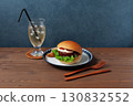 Teriyaki burger on a plate on a wooden table 130832552