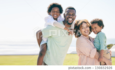 Smile, happy and portrait of a black family at beach for travel, vacation and piggyback on nature mockup. Relax, face and trip with children and parents embrace and bond while traveling in Cuba 130832926