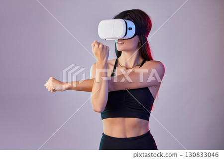 Virtual reality, fitness and woman stretching in metaverse studio isolated on a purple background. 3d exercise, vr and female athlete warm up, workout or training with futuristic headset for esports. Virtual reality, fitness and woman stretching in metaverse studio isolated on a purple background. 3d exercise, vr and female athlete warm up, workout or training with futuristic headset for esports. 130833046