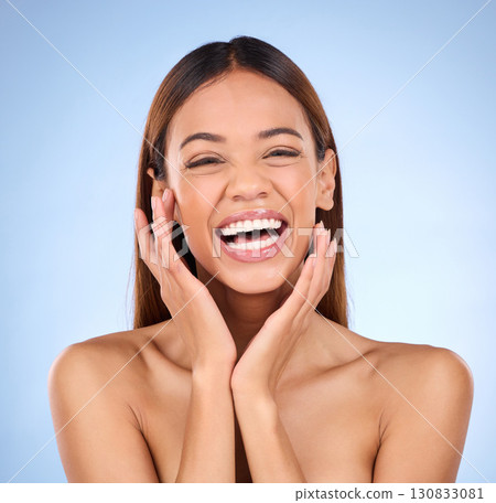 Happy woman in portrait, face and beauty with cosmetic care, facial and laughing in blue background. Skincare, natural cosmetics and self love with happiness, female with smile in studio and glow Happy woman in portrait, face and beauty with cosmetic care, facial and laughing in blue background. Skincare, natural cosmetics and self love with happiness, female with smile in studio and glow 130833081