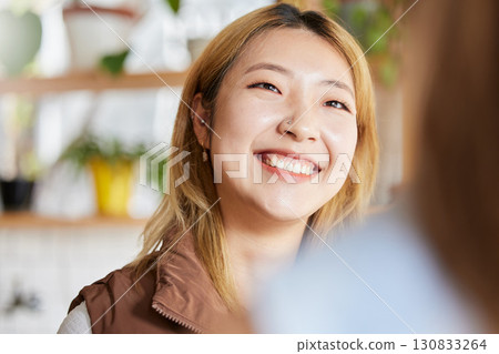 Face, happy or smile and an asian woman in a coffee shop, enjoying spending time with a friend. Cafe, brunch and lifestyle with an attractive young girl sitting in a restaurant for a chat or catch up Face, happy or smile and an asian woman in a coffee shop, enjoying spending time with a friend. Cafe, brunch and lifestyle with an attractive young girl sitting in a restaurant for a chat or catch up 130833264