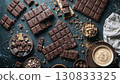 Chocolate bars and pieces and pieces forming a delicious composition. 130833325