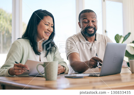 Budget, laptop and interracial couple planning home finance, savings or mortgage and taxes together in the living room. Couch, sofa and people review financial insurance document or paperwork Budget, laptop and interracial couple planning home finance, savings or mortgage and taxes together in the living room. Couch, sofa and people review financial insurance document or paperwork 130833435