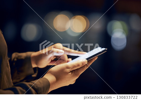 Closeup, hands and person with smartphone, night and typing with connection, communication and chatting. Zoom, woman and female with cellphone, light and search internet for information and website Closeup, hands and person with smartphone, night and typing with connection, communication and chatting. Zoom, woman and female with cellphone, light and search internet for information and website 130833722