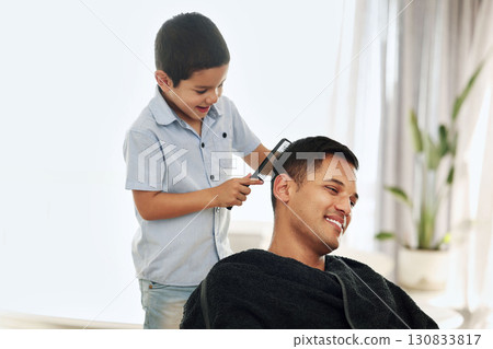 Father, family and kid comb hair in home for grooming, cleaning and styling. Smile, hairdresser and happy boy or child combing man and dad for new look or hairstyle while bonding and playing in house 130833817