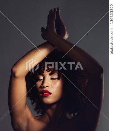 Beauty, shadow and woman with skincare, cosmetics and dermatology against a dark studio background. Female, makeup and lady with fantasy, confidence and treatment with grooming, smooth and soft skin 130833890