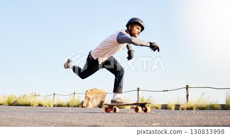 Skateboard, sports action and man in road for competition, training and exercise challenge in city. Skating, skateboarding and male skater with focus for speed, adventure and freedom in extreme sport Skateboard, sports action and man in road for competition, training and exercise challenge in city. Skating, skateboarding and male skater with focus for speed, adventure and freedom in extreme sport 130833998