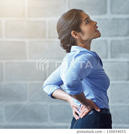 Back pain, office stress and business woman with muscle injury, health risk and fatigue on mockup wall. Uncomfortable female worker, spine problem and bad posture of injured body, scoliosis and joint Back pain, office stress and business woman with muscle injury, health risk and fatigue on mockup wall. Uncomfortable female worker, spine problem and bad posture of injured body, scoliosis and joint 130834055