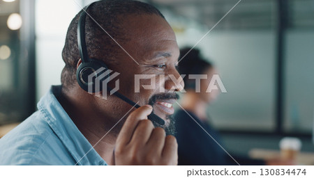 Business man, call center and speaking, night communication or technical support for software solution. Happy african person, agent or consultant helping and advice at IT tech company or work agency 130834474
