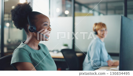 Business woman, call center and computer with happy communication, customer services and online solution. Excited african person, agent or consultant helping, talking and advice in sales at night 130834495