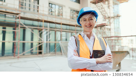 Senior woman in portrait, construction site and architect, inspection and arms crossed with professional contractor. Property development, renovation and urban infrastructure, architecture and boss Senior woman in portrait, construction site and architect, inspection and arms crossed with professional contractor. Property development, renovation and urban infrastructure, architecture and boss 130834654