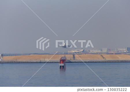 Passenger plane taking off from Haneda Airport 130835222