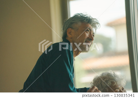 Husband caring for his wife Husband caring for his wife 130835341