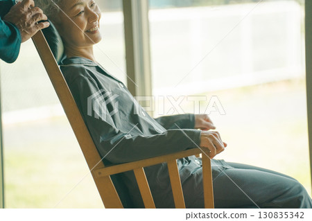 Rocking chair and elderly person Rocking chair and elderly person 130835342