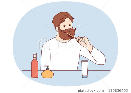 Brutal man takes care of beard and mustache, uses comb to create beautiful image Brutal man takes care of beard and mustache, uses comb to create beautiful image 130836403