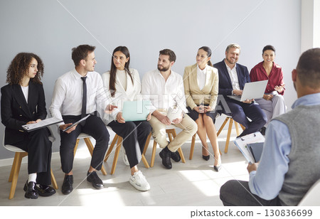 Business Team Working Together During Office Meeting Business Team Working Together During Office Meeting 130836699