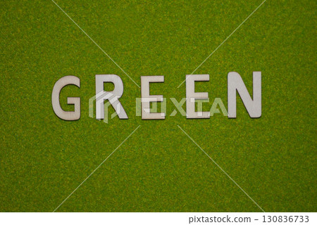 The word GREEN appears in front of a green background The word GREEN appears in front of a green background 130836733