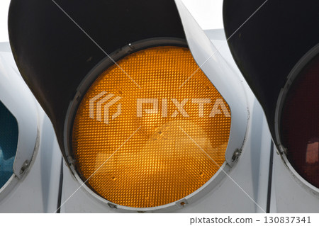 Yellow heat bulb traffic light 130837341