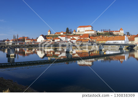 Ptuj Castle reflecting on Drava River with bridge in Ptuj, Slovenia Ptuj Castle reflecting on Drava River with bridge in Ptuj, Slovenia 130838309