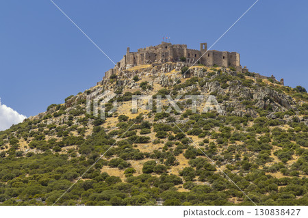 Calatrava la Nueva Castle dominating the landscape in Ciudad Real, Spain 130838427
