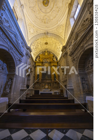 Ornate Golden Altar and Pews inside Baeza Cathedral in Spain Ornate Golden Altar and Pews inside Baeza Cathedral in Spain 130838428