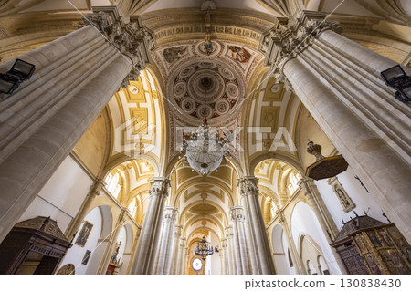 Baeza Cathedral interior showing columns, dome, and chandeliers in Andalusia, Spain 130838430