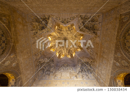 Eight pointed star ceiling of the Alhambra Palace in Granada, Spain, showing intricate moorish designs Eight pointed star ceiling of the Alhambra Palace in Granada, Spain, showing intricate moorish designs 130838434