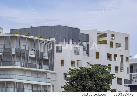 Modern Apartment Buildings with Balconies and Green Roof in Montpellier, France 130838472
