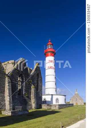 Saint Mathieu Lighthouse standing tall next to ancient abbey ruins in Brittany, France Saint Mathieu Lighthouse standing tall next to ancient abbey ruins in Brittany, France 130838487