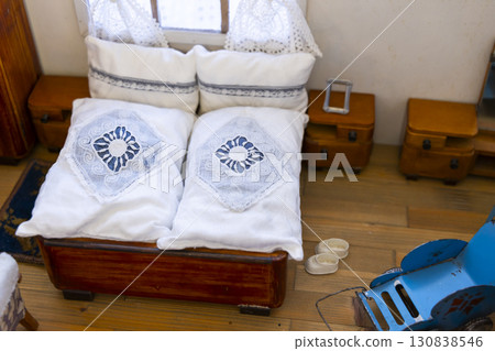 Miniature bedroom with bed, pillows, bedside tables and a toy stroller in Jaromerice nad Rokytnou, Czechia 130838546
