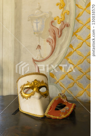 Venetian carnival masks resting on a wooden table in Jaromerice nad Rokytnou, Czechia 130838570
