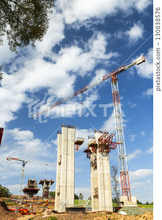Cranes working on highway bridge construction in D11 near Bernartice, Czechia Cranes working on highway bridge construction in D11 near Bernartice, Czechia 130838576