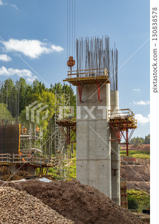 Construction workers building concrete bridge support pillars in D11 near Bernartice, Czechia 130838578