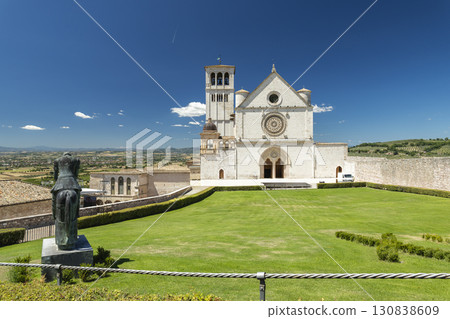 Papal Basilica of Saint Francis of Assisi overlooking Umbrian Valley in Assisi, Italy 130838609