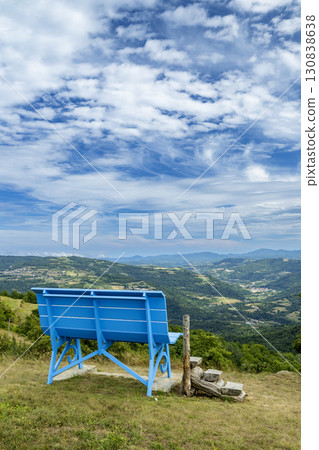 Giant blue bench overlooking the Piedmont hills in Niella Belbo, Italy 130838638