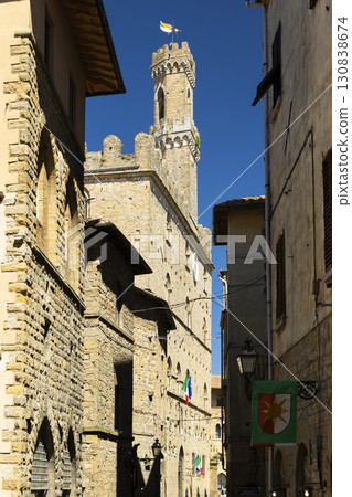 Palazzo dei Priori rising over narrow street in Volterra, Tuscany Palazzo dei Priori rising over narrow street in Volterra, Tuscany 130838674