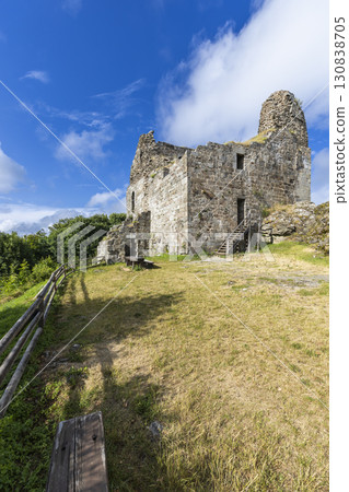Ruins of Primda Castle rising on a hill under blue sky in Czechia 130838705