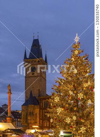Christmas tree illuminating Old Town Square in Prague at twilight 130838740