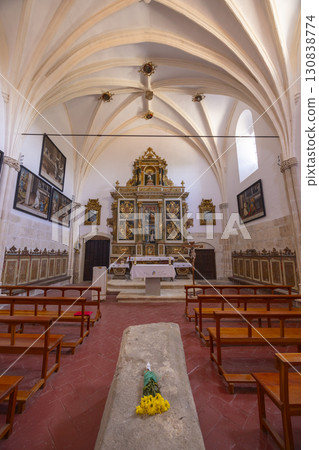 Interior of Church of Barrios de Colina showing altar, paintings and tomb with flowers in Castilla and Leon, Spain Interior of Church of Barrios de Colina showing altar, paintings and tomb with flowers in Castilla and Leon, Spain 130838774