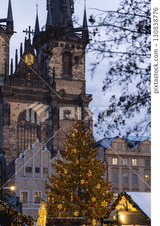 Illuminated Christmas tree standing in Old Town Square with Church of Our Lady before Tyn in Prague Illuminated Christmas tree standing in Old Town Square with Church of Our Lady before Tyn in Prague 130838776