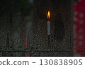 The dignified candle flame stretches out 130838905