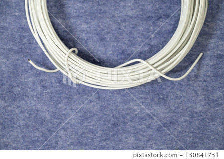 White electric wires on a blue background 130841731