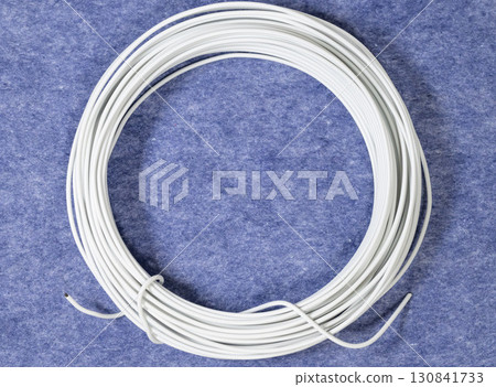 Blue fabric and white electrical wires Blue fabric and white electrical wires 130841733