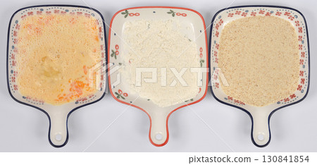 Beaten eggs, flour, and breadcrumbs for breading 130841854