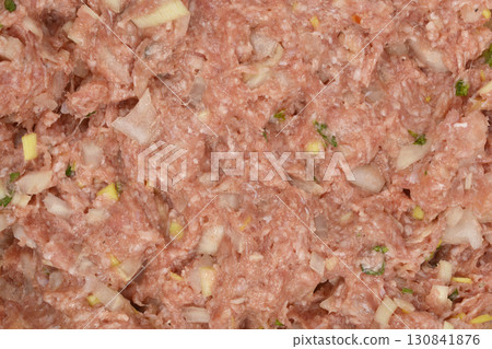 Raw ground pork and beef mixed with onions and spice Raw ground pork and beef mixed with onions and spice 130841876