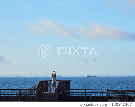 A senior man walking on the beach at Shin-Urayasu Park in summer 130842307