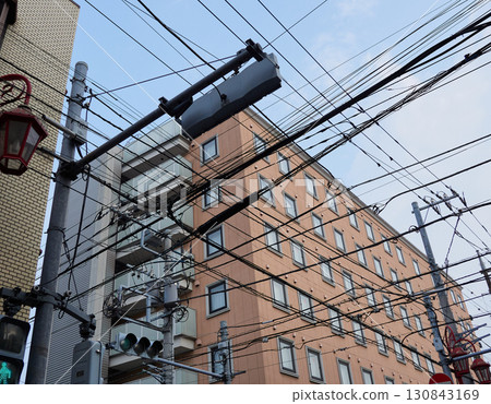 Buildings, utility poles, and complex electrical wires in Tokyo Buildings, utility poles, and complex electrical wires in Tokyo 130843169
