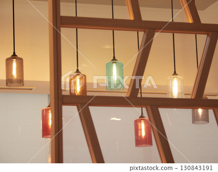 Lights decorating the ceiling of a hotel lobby 130843191