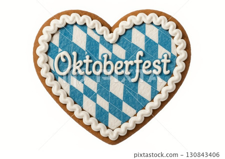 Gingerbread heart with white icing and blue Bavarian pattern featuring Oktoberfest text, isolated on white background 130843406