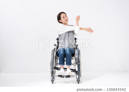 Wheelchair yoga stretching Wheelchair yoga stretching 130843542